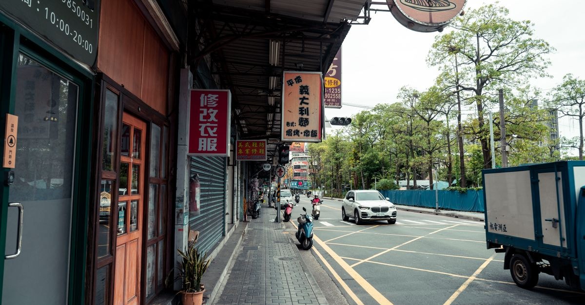 Jinghong Travel Guide: Getting Around and Eating Well A vibrant street scene in Shilin District, Taipei, capturing daily urban life.