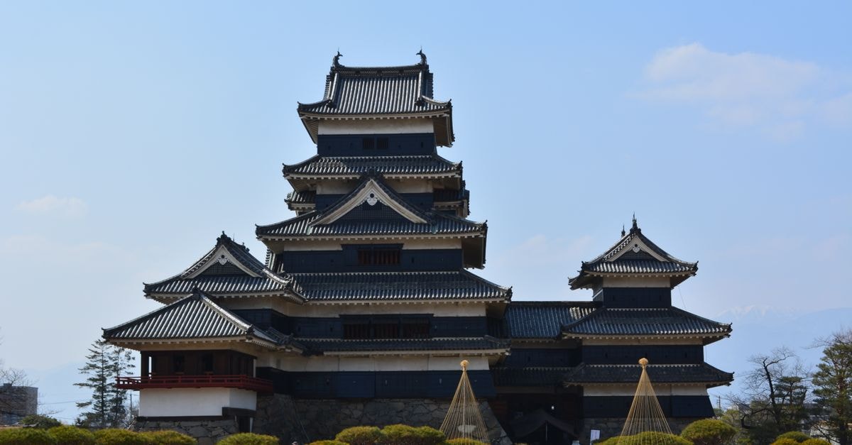 Matsumoto travel guide: a castle-town rhythm worth slowing for Stunning view of Matsumoto Castle, a historic Japanese landmark, with clear blue sky.