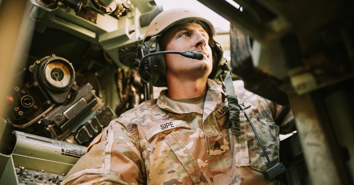 Union Pacific turns fuel surcharges into profit as Iran war lifts diesel prices A soldier in camouflage uniform inside an armored vehicle, looking focused.