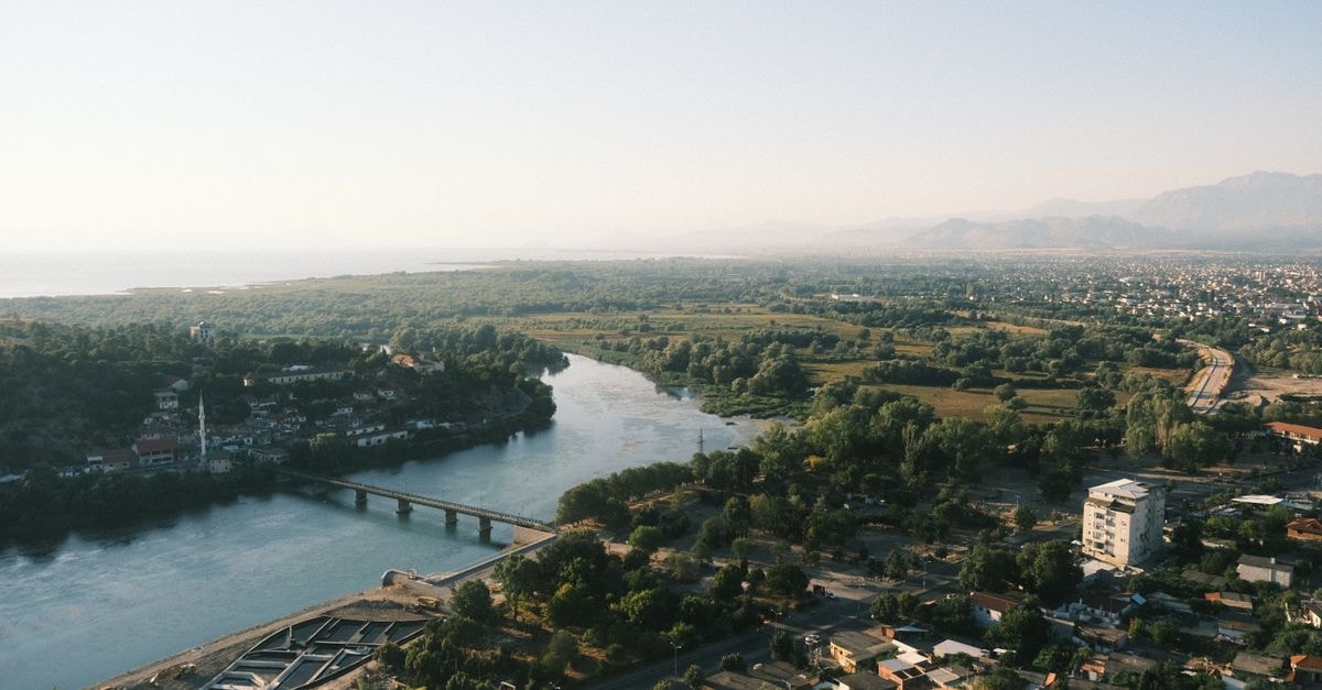 Hotel Colosseo in Shkoder: A Long-Running Stay on Rruga At Gjergj Fishta A beautiful aerial view capturing the serene landscape and river in Shkodra, Albania.