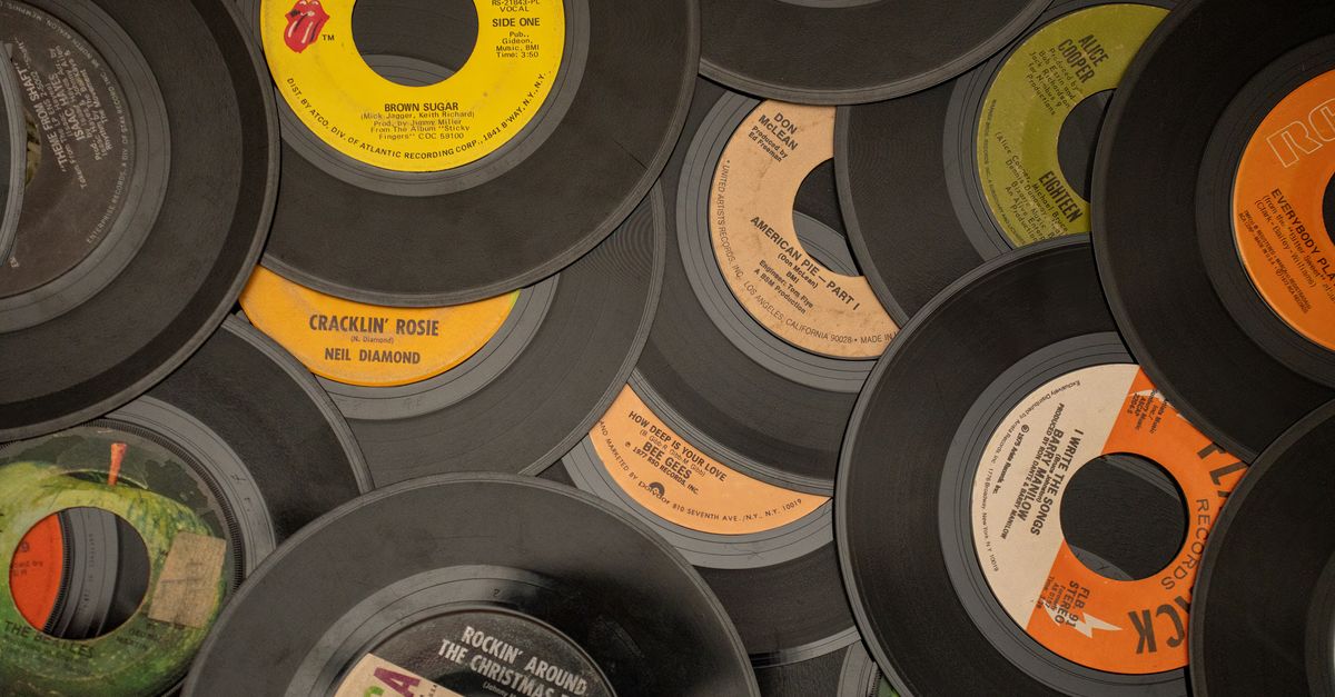 Rolling Stones Top Billboard Album Sales Chart as 'Foreign Tongues' Debuts at No. 1; Charli xcx Releases 'Music, Fashion, Film' A collection of vintage vinyl records showcasing iconic music labels and artists.