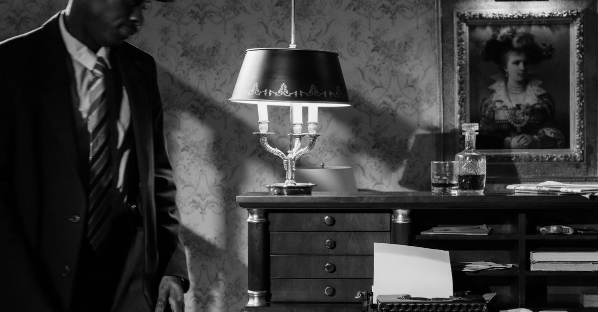 'Street Fighter' tops global box office with $50.1M debut; Paramount-Legendary film opens to $31M domestically Moody black and white photo of a detective in a vintage office, evoking classic noir cinema.