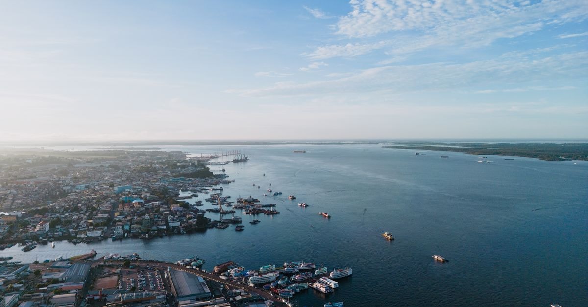 Swiss-Belhotel in Sorong: A Jalan Sudirman Address in Southwest Papua Stunning aerial shot of Manaus harbor along Rio Negro with ships and cityscape under a clear sky