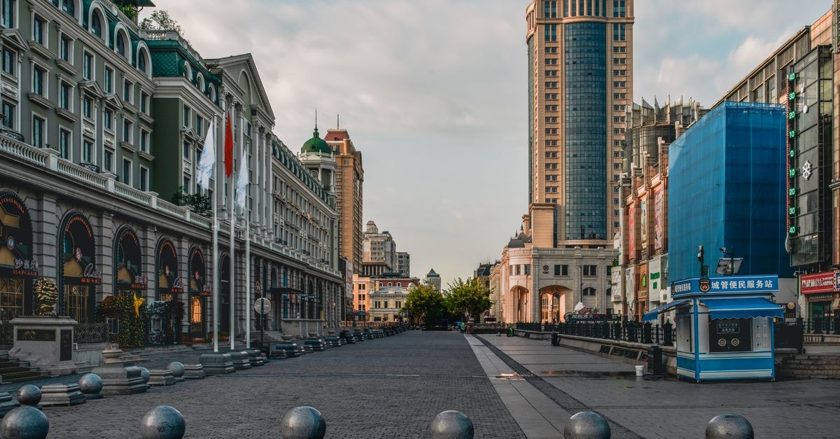 View of Harbin's Central Avenue with classic and modern buildings.
