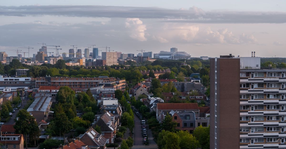 Leonardo Hotel Utrecht City Centre in Utrecht: A Vredenburg Stay With Cabaret-Era Roots Aerial view of Diemen during evening with Amsterdam skyline and architecture.