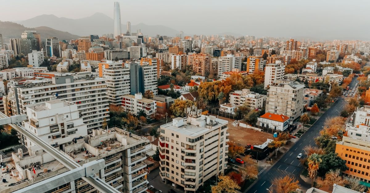 Aerial view of the vibrant Santiago cityscape during the day, showcasing modern architecture.