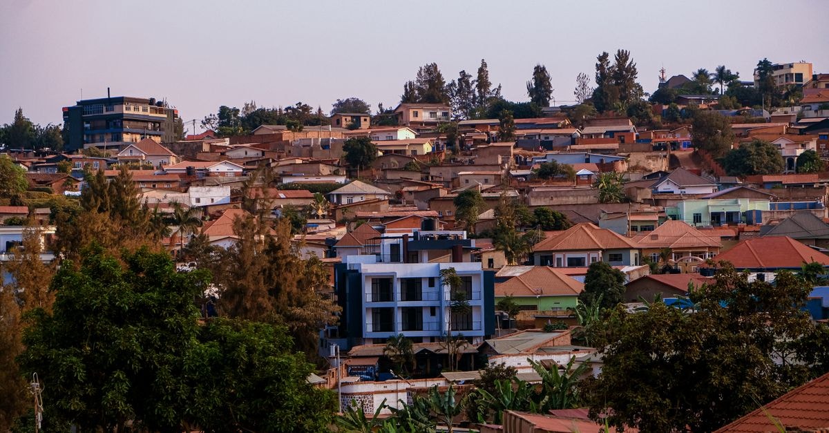 Broadpark Hotels in Mbale: A Rooftop Stop on Vihiga–Maragoli Road A vibrant panorama of Kigali's residential area showcasing architecture and greenery at sunset.