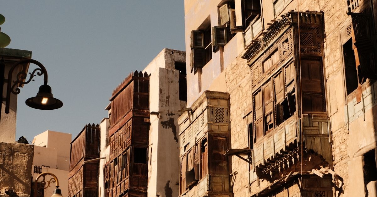 Sunlit traditional architecture in Al-Balad, Jeddah, showcasing historic charm and intricate design.