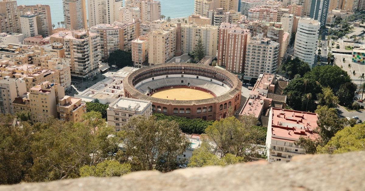 Scenic aerial view of Plaza de Toros and surrounding cityscape in Malaga, Spain.