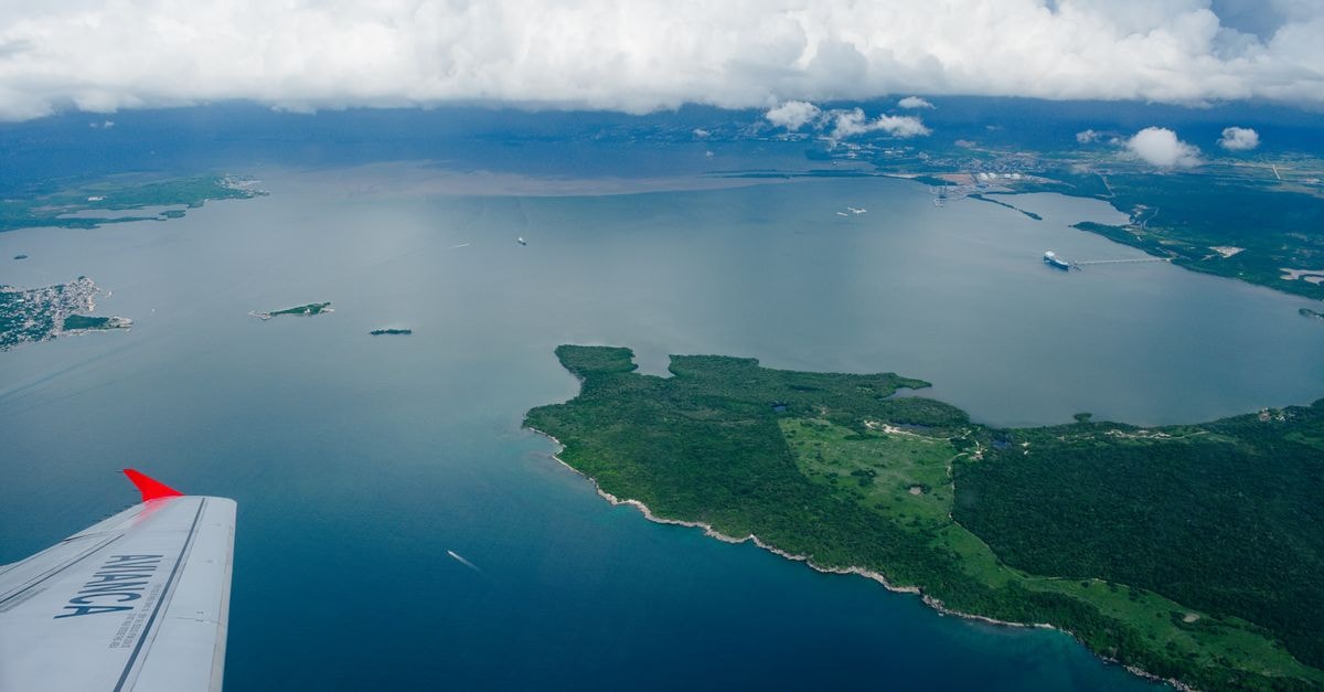 Abancay travel guide: weather rhythms and ways to arrive Stunning aerial shot of coastline and islands from an airplane window.