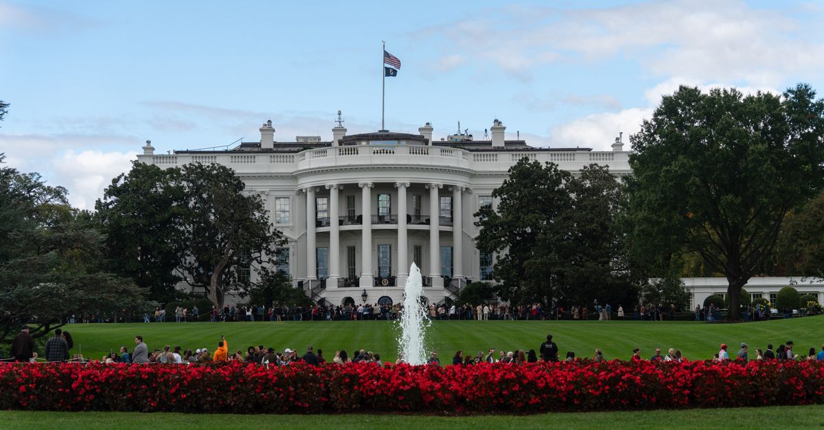 Senior White House official accuses Moonshot AI of distilling Anthropic frontier model A stunning view of the White House with its garden and fountain, capturing a bright day scene.
