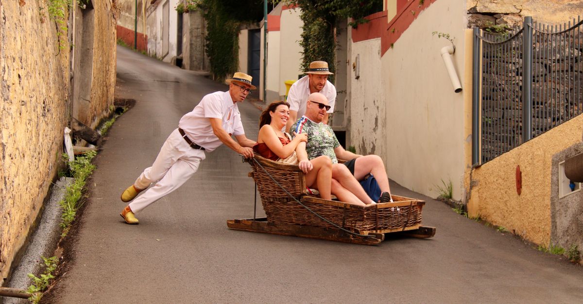 Funchal in July: A Travel Guide for Peak Season in Madeira's Capital Experience the thrilling traditional wicker toboggan ride down Funchal's steep streets in Madeira, Portugal.