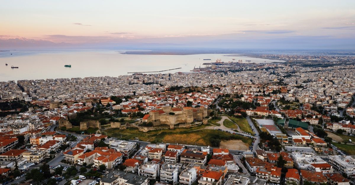 Capsis Hotel Thessaloniki in Greece: Northern Greece's Largest City Hotel Aerial view of the historic city of Thessaloniki, Greece at sunset showing the cityscape and coast.