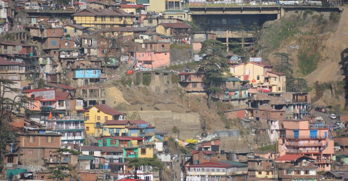 The Cedar Grand, Shimla: Cedar Forest Views Near Mall Road Vibrant hillside architecture in Shimla, highlighting colorful homes and urban density.