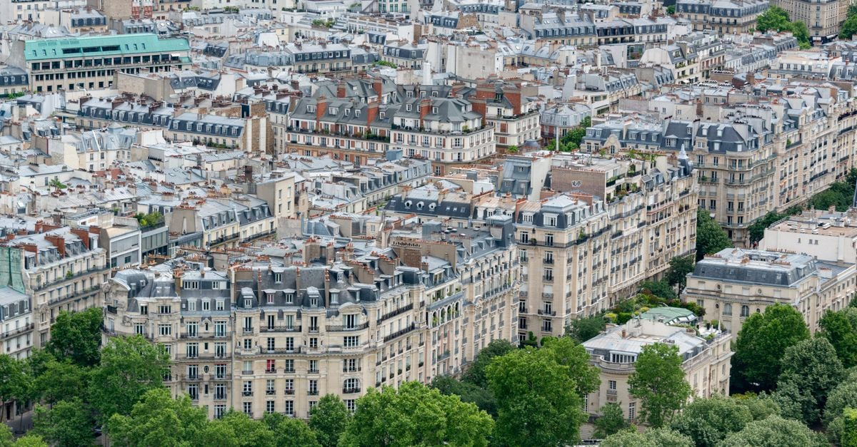 Stunning aerial view of classic Parisian architecture and rooftops, showcasing the city's unique charm.