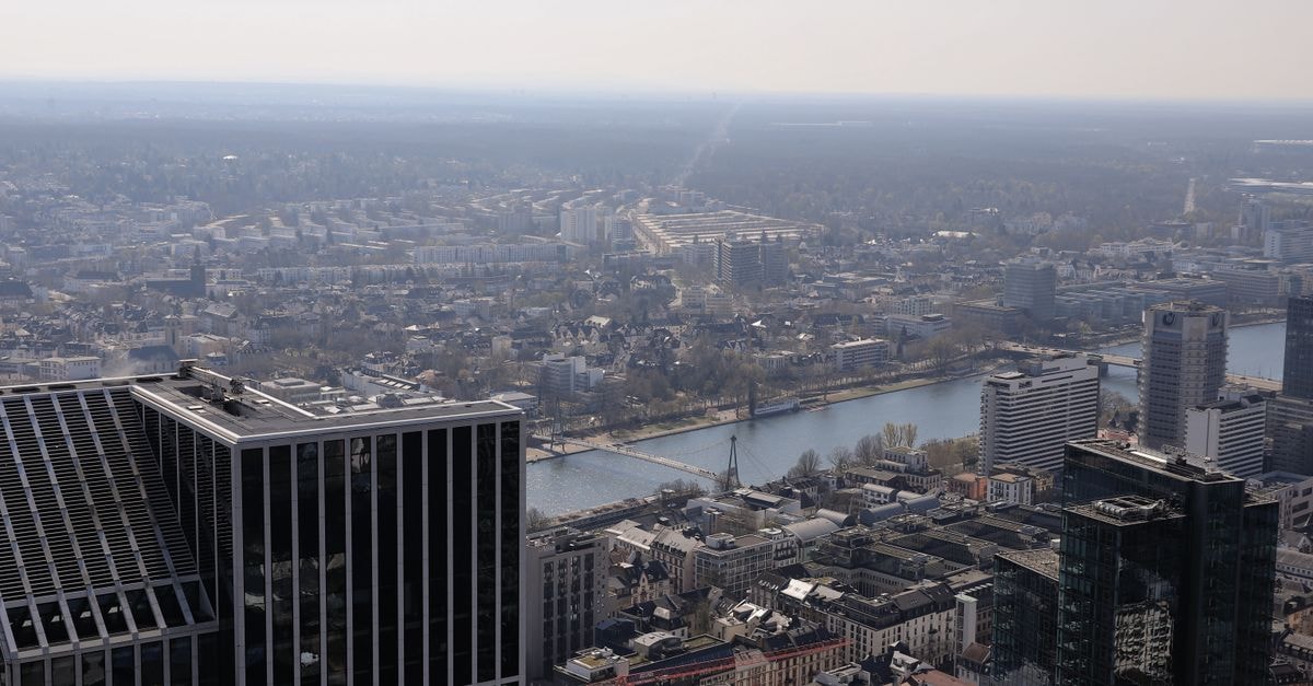 A stunning aerial view of Frankfurt, showcasing skyscrapers and the Main River.