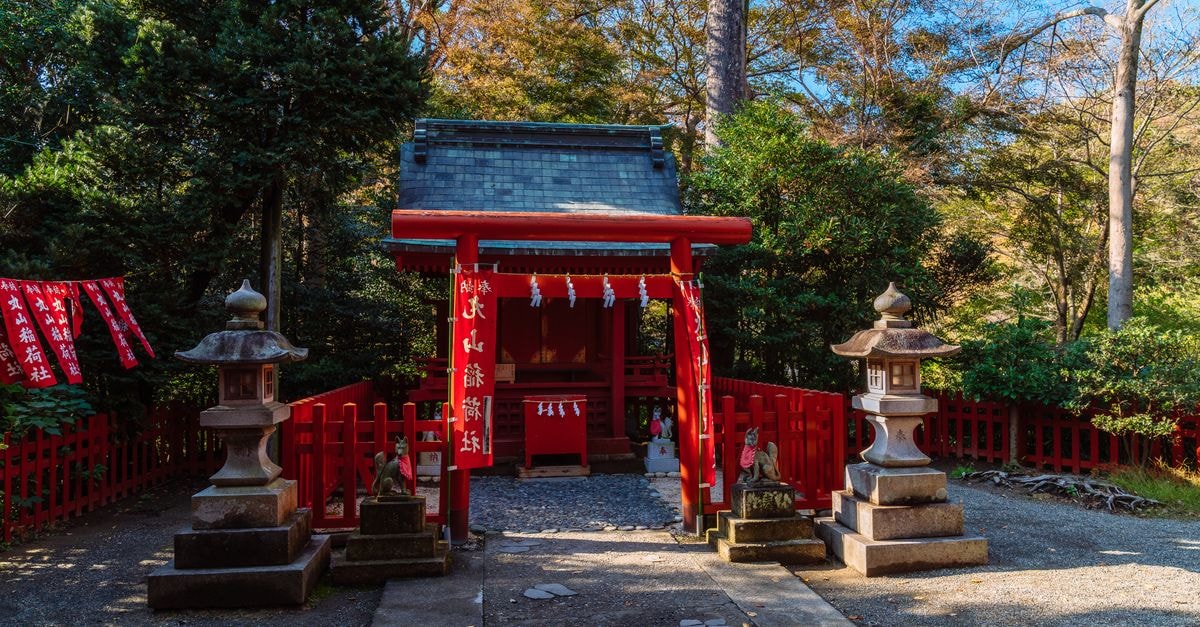 Nishinomiya Travel Guide: Baseball, Shrines and Easy Connections Serene view of a traditional Japanese shrine entrance in Kamakura, Japan, surrounded by nature.