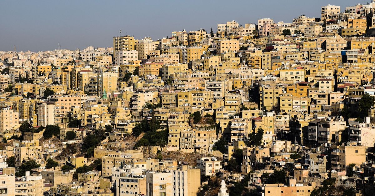 Densely packed urban buildings in Amman, Jordan captured from above, showcasing cityscape.