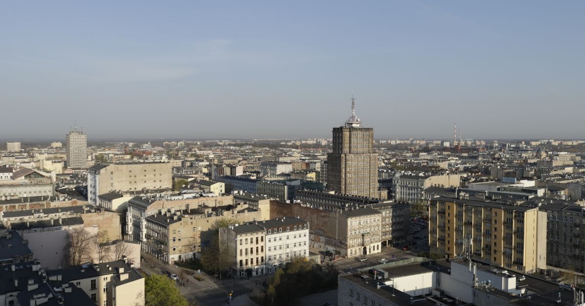 Qubus Hotel in Gorzów Wielkopolski: Park-View Stay in the City Center Aerial shot capturing a sprawling cityscape with varied architecture in daylight.