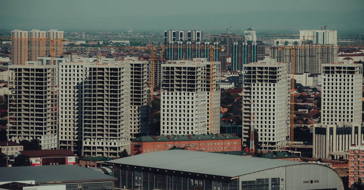 Aerial view of construction and urban development in Grozny, showcasing modern skyscrapers and cityscape.