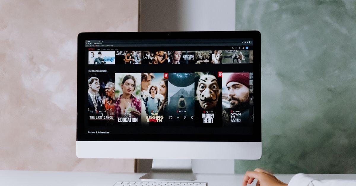 Streaming New Releases Roundup: Devil Wears Prada 2 Leads a Packed Week Across JioHotstar, Netflix and Prime Video A modern workspace featuring a desktop screen displaying popular streaming series on Netflix.