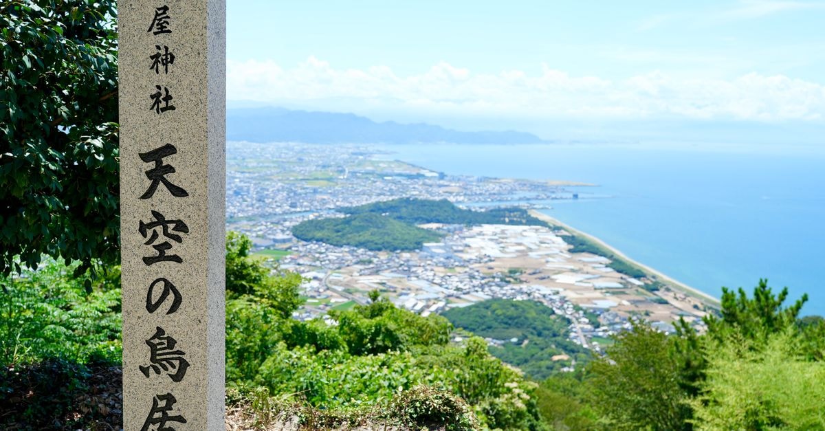 Tokushima Travel Guide: Slow Days in Shikoku's Quiet Capital Scenic view from Takaya Shrine over Japanese coastline and city.