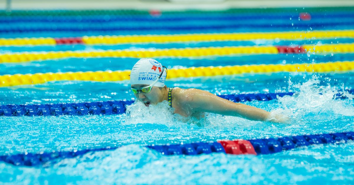 Scott ends Australian swim dominance with Glasgow gold as Fairweather, Ouwehand and Firth claim bronze Swimmer competes in race, showcasing technique and determination in a vibrant swimming pool setting.