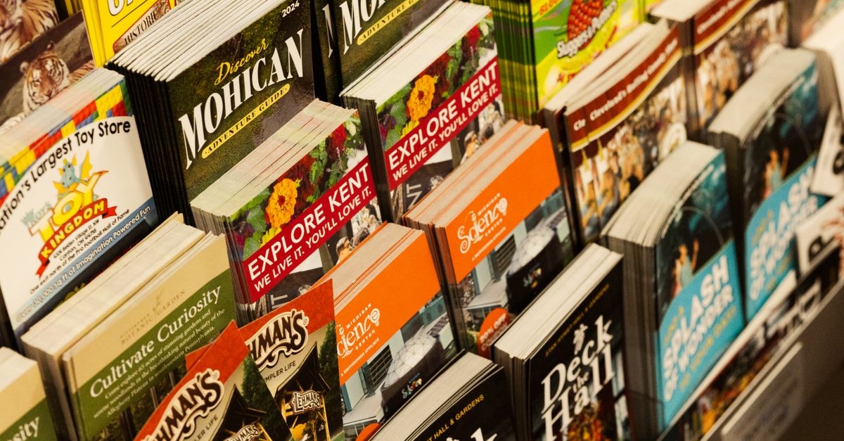 Visiting Majuro: A Quiet Pacific Travel Guide Colorful collection of travel brochures on display at a bookstore.