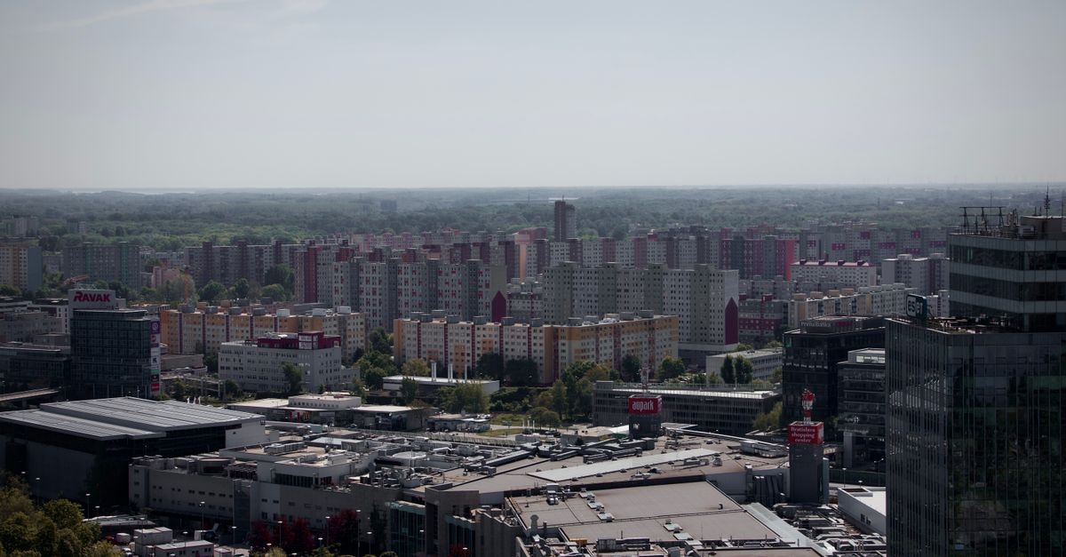 Hotel Ibis Styles Bialystok: Central Stay with Panoramic City Views Drone shot capturing the cityscape of Bratislava, Slovakia with apartment buildings and commercial areas.