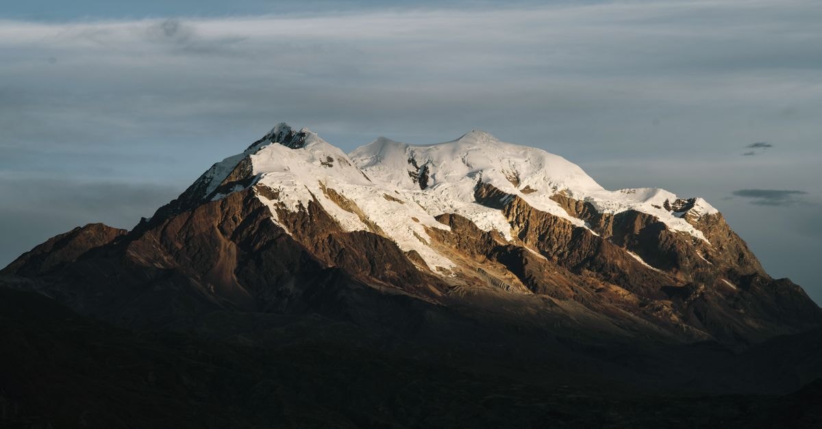 Scenic view of a snow-capped mountain peak in Bolivia, capturing natural beauty and tranquility.