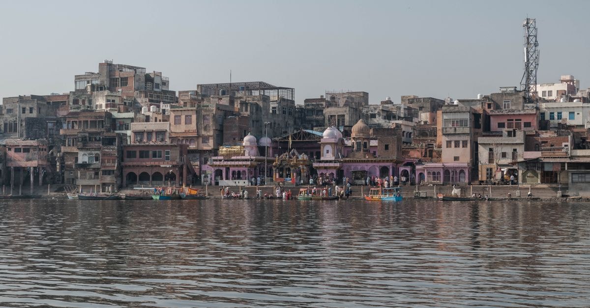 A Pilgrim's Mathura Travel Guide: Temples, Ghats and Sweet Streets Picturesque view of historic ghats along Yamuna River in Mathura, Uttar Pradesh, India.