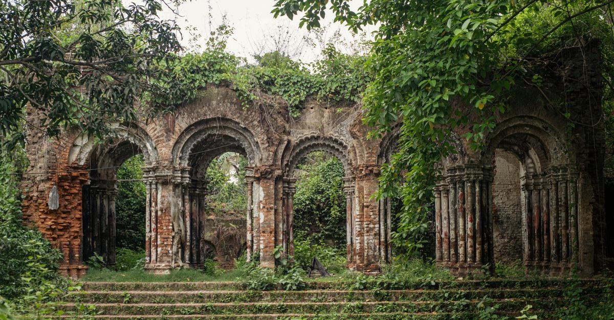 Panihati Travel Guide: A Hooghly-Side Town Worth a Slow Afternoon Historic brick ruins covered in lush greenery, showcasing architectural beauty and nature reclaiming structures.