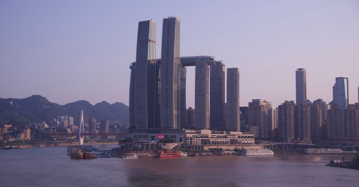 Marriott Executive Apartments Chongqing: Apartment-Style Stay in Jiefangbei Captivating view of Raffles City and skyline by the Yangtze River in Chongqing, China.