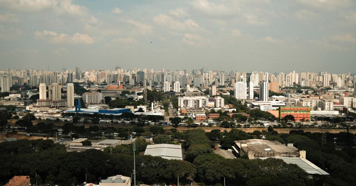 Santuário de São José de Ribamar in São José de Ribamar: A Seaside Sanctuary of Faith Explore São Paulo's sprawling urban skyline under a clear sky, showcasing city life and architecture.