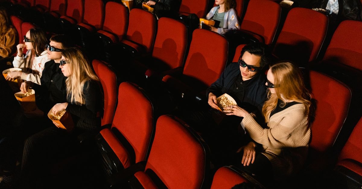 McNish outlines the lessons from Senna and Audi that shaped his F1 racing director role People in a theater wearing 3D glasses watching a movie with popcorn.