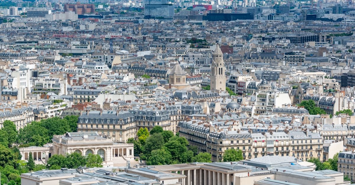 Paris Travel Guide: A Thoughtful Way to Plan Your Stay An aerial view of Paris showcasing the city's iconic architecture and landmarks on a bright day.