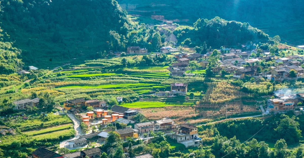 Chifeng Travel Guide: Planning Tips, Costs and Things to Do Lush terraced fields in Hà Giang, Vietnam, surrounded by mountains and traditional villages under a bright sky.