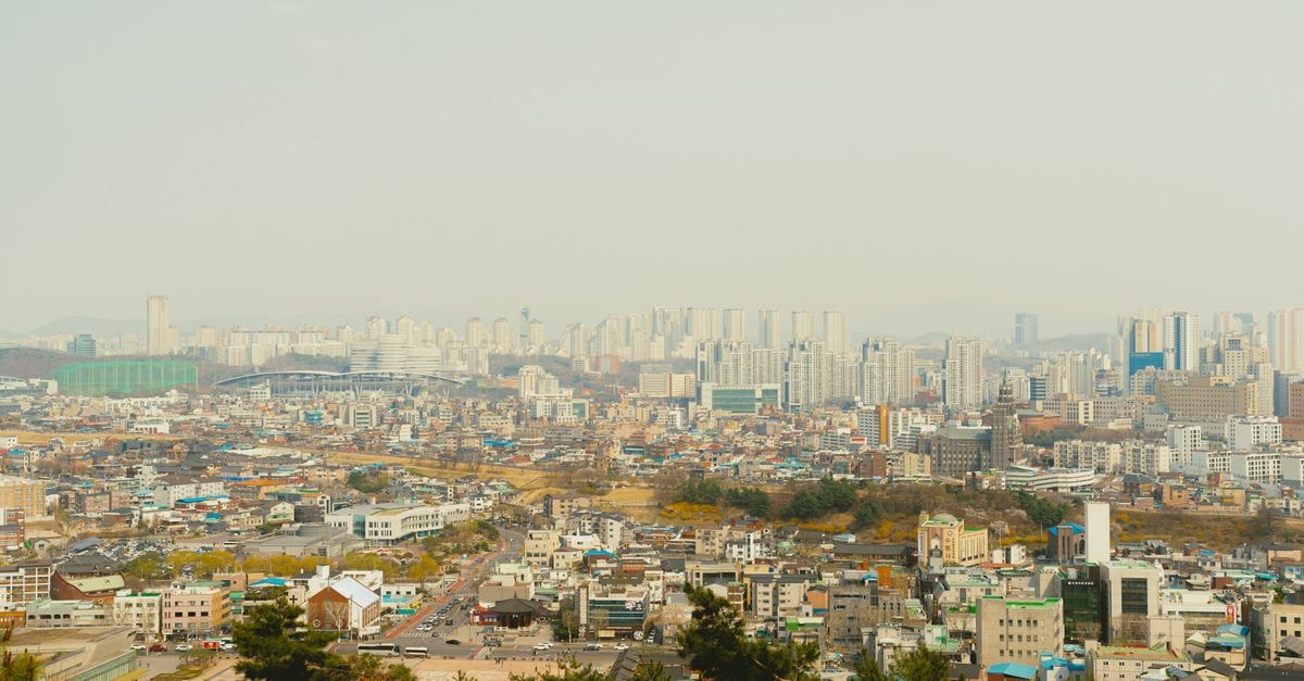 Aerial view of Seoul showcasing modern architecture and sprawling cityscape.