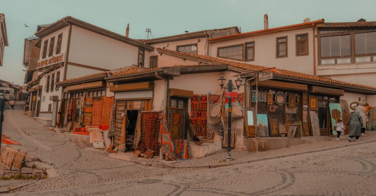 Slow Days in Malatya: An Eastern Türkiye Travel Guide Explore the vibrant traditional shops on a cobblestone street in Ankara's historic district.