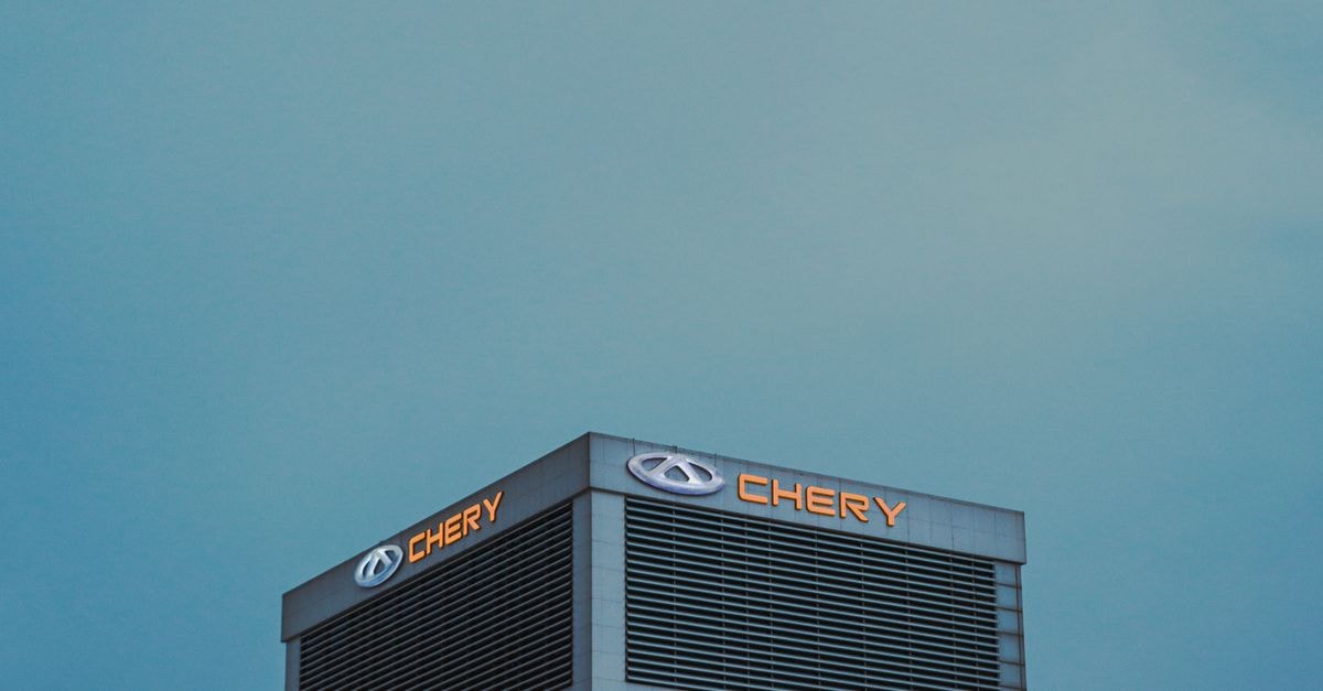 A modern Chery building in Erbil, Kurdistan Region, Iraq, with a clear sky backdrop.