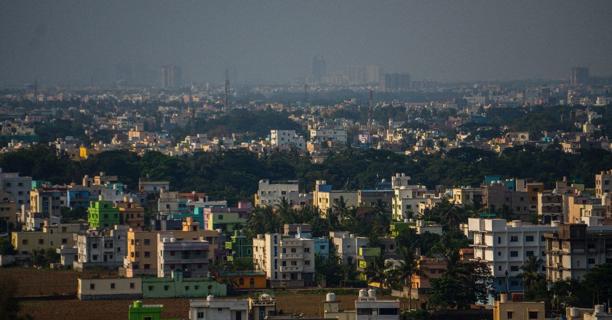 Haritha Indur Inn (TSTDC) in Nizamabad: A TSTDC Stay Near the Railway Station Aerial view of urban buildings and lush greenery in Bhubaneswar, India, showcasing vibrant architecture and dense population.