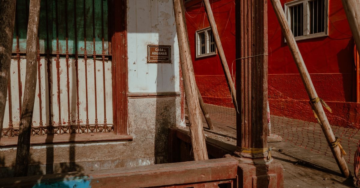 Capture of the weathered Casa Aduanas building in vibrant Pacasmayo, Peru.