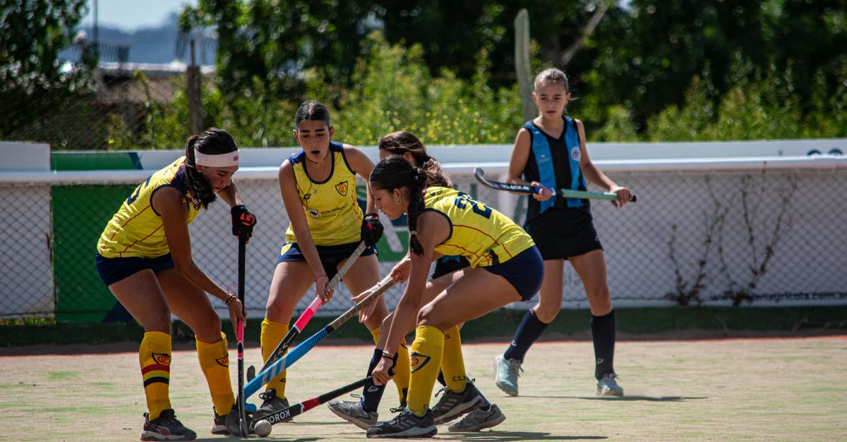 Katseye's 'Animal,' co-written by Ed Sheeran, leads new K-pop releases from Jennie and aespa Young athletes competing in a dynamic field hockey game outdoors, showcasing teamwork and skill.
