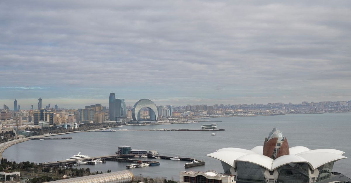 Scenic aerial view of Baku, Azerbaijan overlooking the Caspian Sea with iconic architecture and urban landscape.