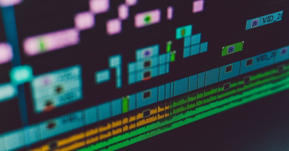 Adobe completes Topaz Labs acquisition, keeps Topaz as standalone brand Detailed view of a video editing software interface showing multi-track timeline and colorful design.