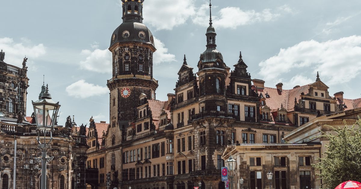 Dresden Travel Guide: Weather, Walks and Getting Around Explore the historic Dresden Castle under a clear summer sky. Ideal for travel and architecture enthusiasts.