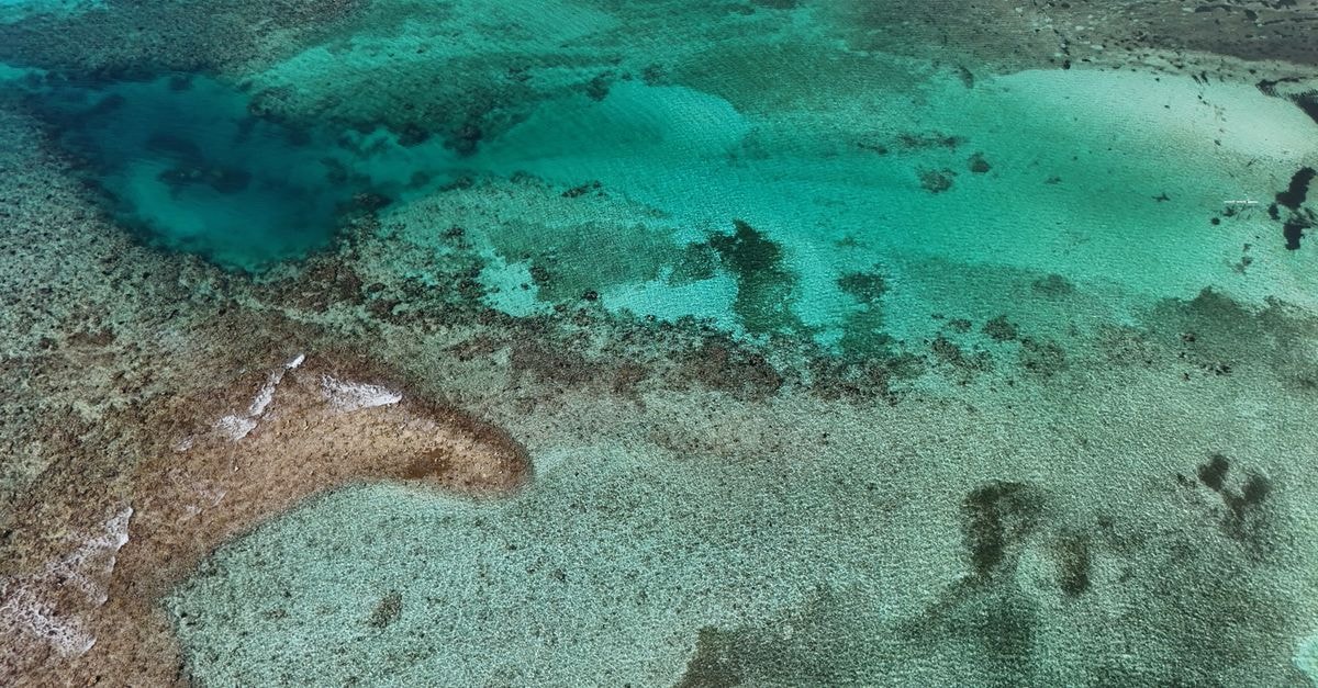 Fomboni travel guide: Mohéli's quiet harbor and reef rhythm Stunning aerial shot of Bacalar Lagoon showcasing vibrant turquoise waters in Quintana Roo, Mexico.