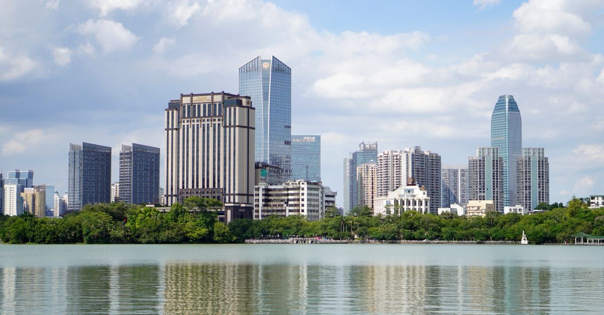 Hampton Ningbo Eastern New Town, Ningbo — A Hilton Brand Debut by the Civic Core Beautiful skyline of Huizhou city with modern skyscrapers reflecting in the river.