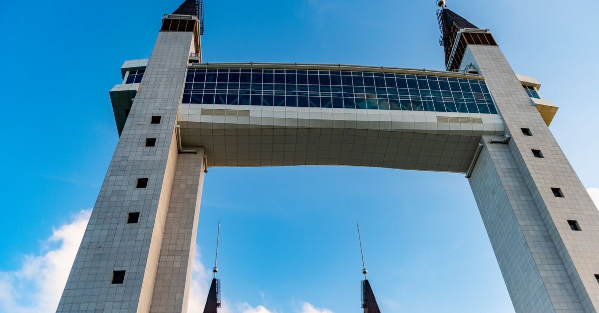 Yenagoa Travel Guide: A Quiet Gateway to Bayelsa Stunning architectural view of the Terengganu Drawbridge against a clear blue sky.