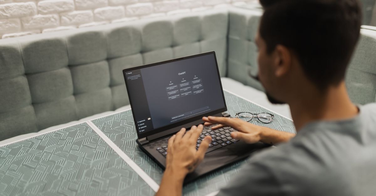 Applied Materials Tops Q2 Estimates but Shares Slide; Five Analyst Questions Highlight AI-Driven Demand and Margin Pressures A man working on a laptop in a cozy, modern office space with a focus on technology.